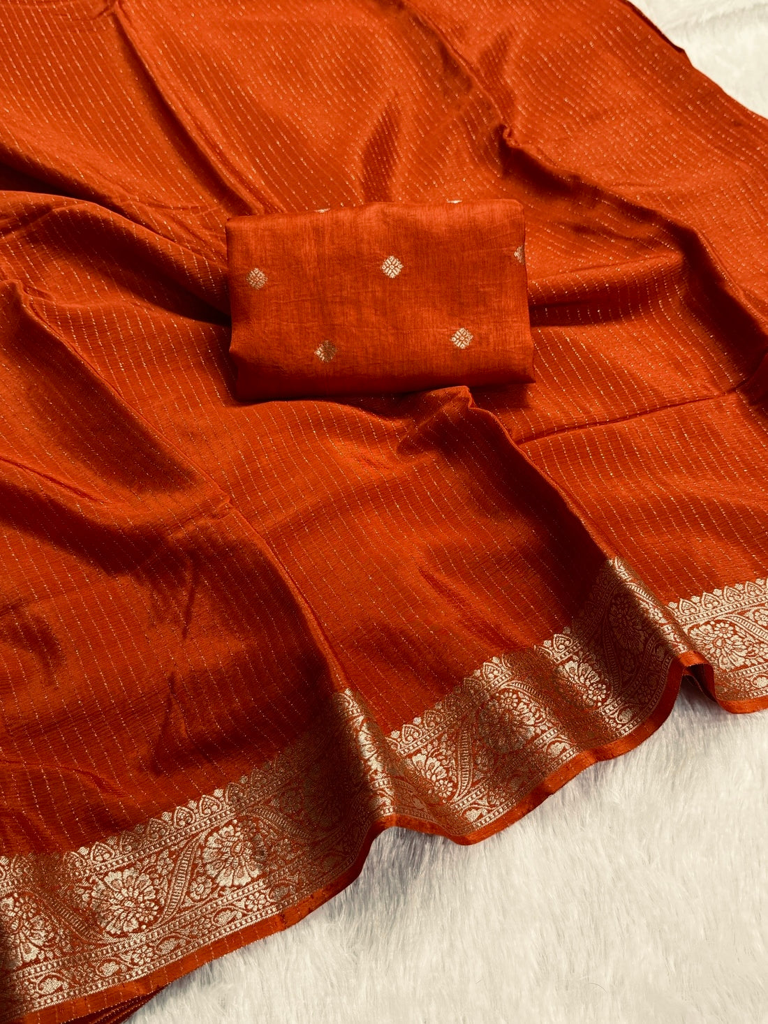 DEEP RUST ORANGE Color Chinon Silk Saree with Jari Lining Allover The Saree with Heavy Weaving Border and Pallu paired with Weaving Chinon Silk Blouse Piece