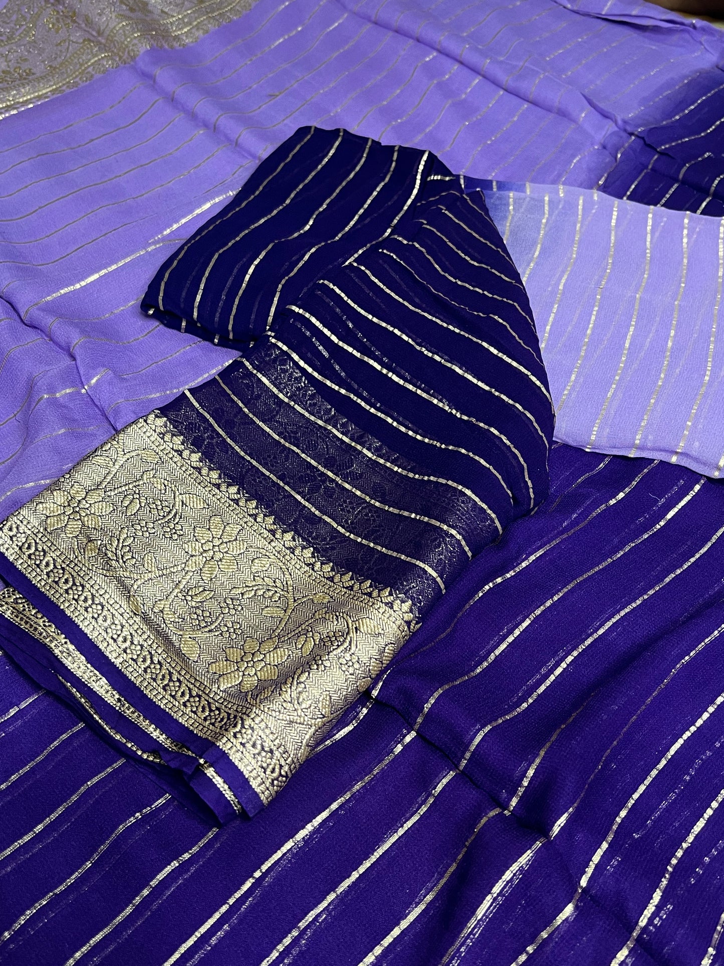 Viscose Georgette Saree with Heavy weaving Border and Jari Lining All Over the Saree Paired with Blouse Piece same as Saree