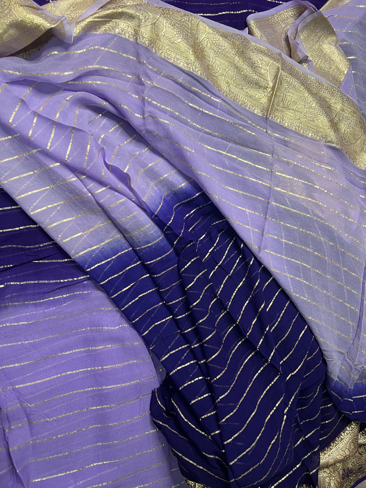 Viscose Georgette Saree with Heavy weaving Border and Jari Lining All Over the Saree Paired with Blouse Piece same as Saree