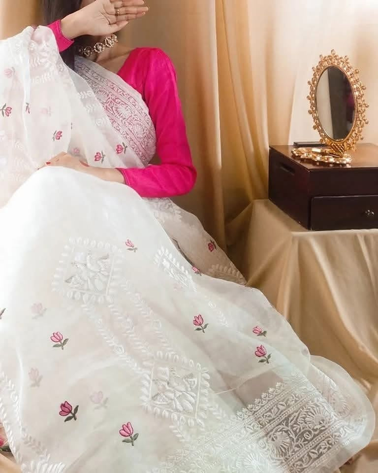 Organza saree with all over embroidery work & with colorful tassels on the pallu