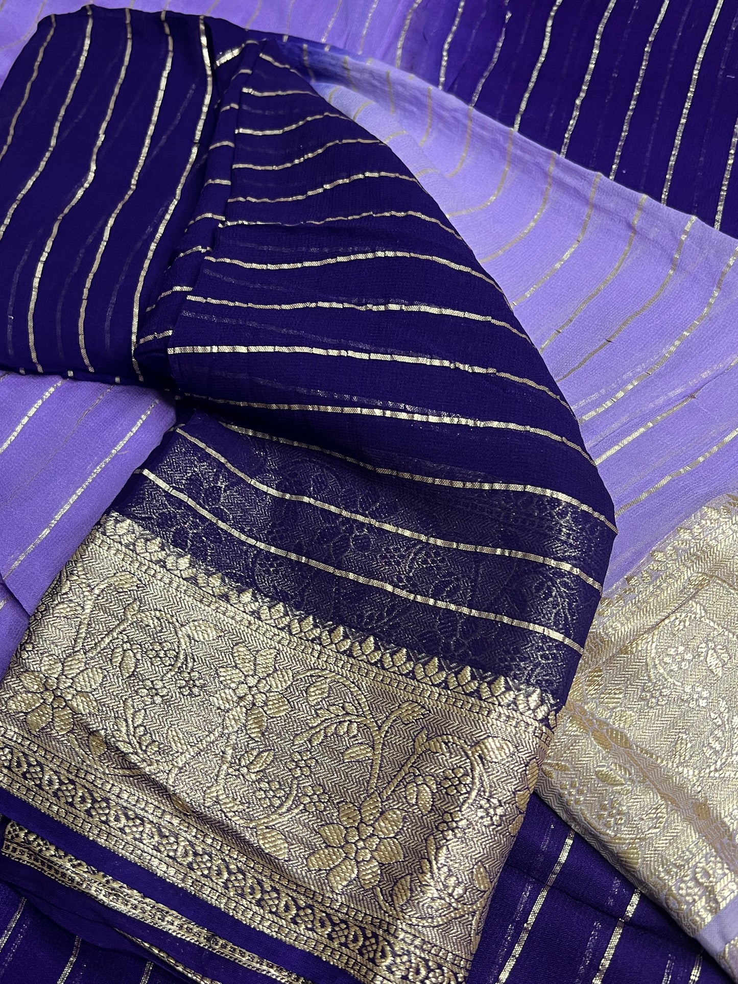 Viscose Georgette Saree with Heavy weaving Border and Jari Lining All Over the Saree Paired with Blouse Piece same as Saree