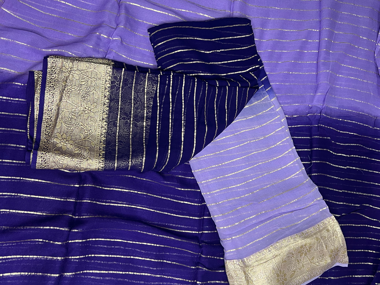 Viscose Georgette Saree with Heavy weaving Border and Jari Lining All Over the Saree Paired with Blouse Piece same as Saree