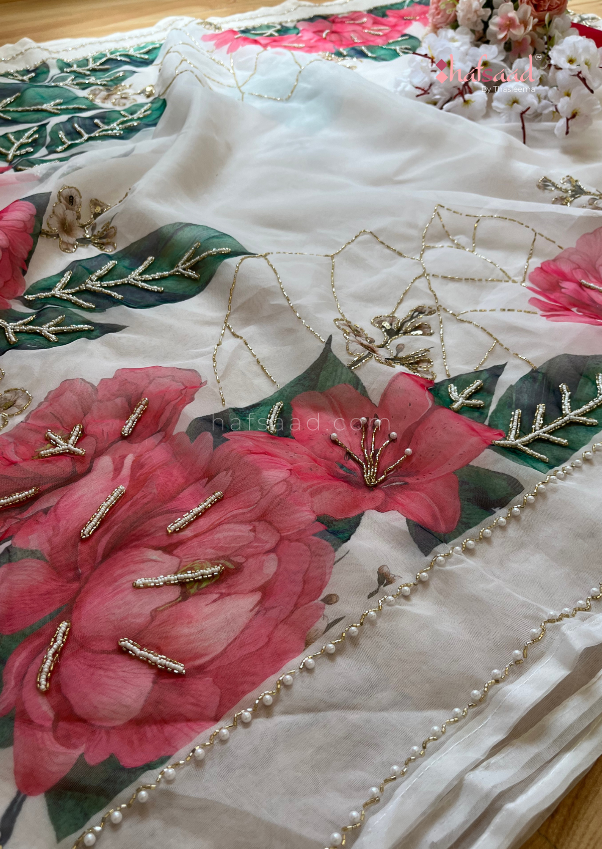 Celestial Printed Elegant Organza Saree with Heavy Handcrafted Khatli and Pearls and Petals work all over saree paired with Plain Cherry Red Color Blouse Piece