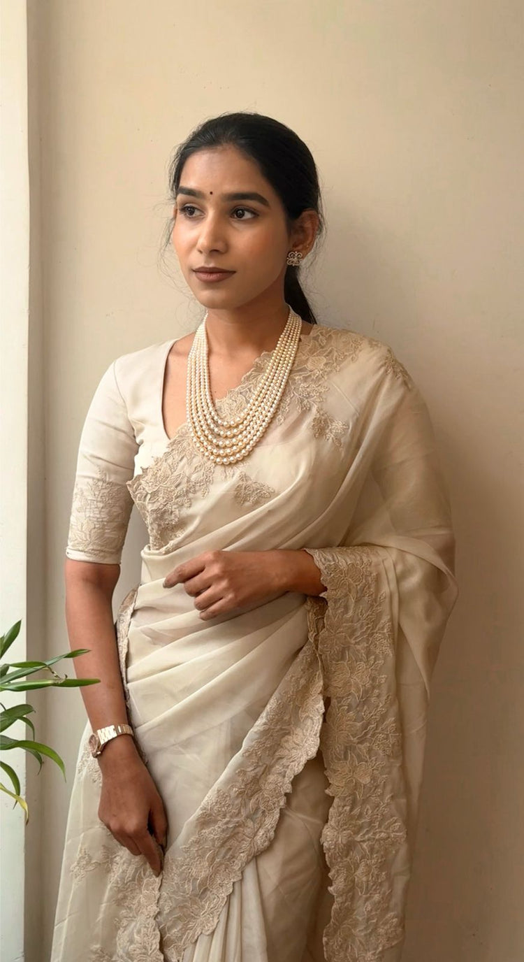 BEIGE Color Tabby organza Saree featuring intricate embroidery work