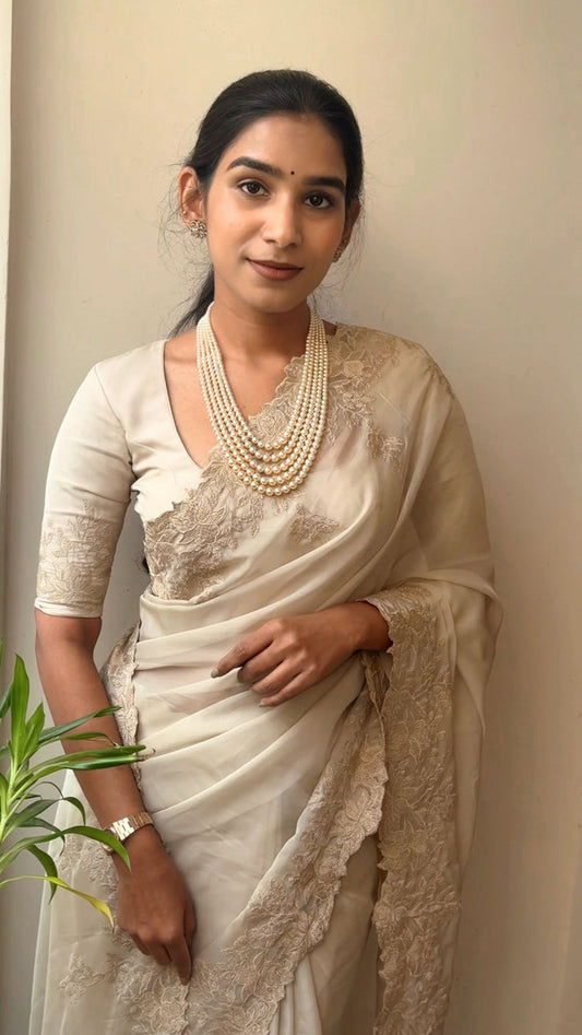 BEIGE Color Tabby organza Saree featuring intricate embroidery work