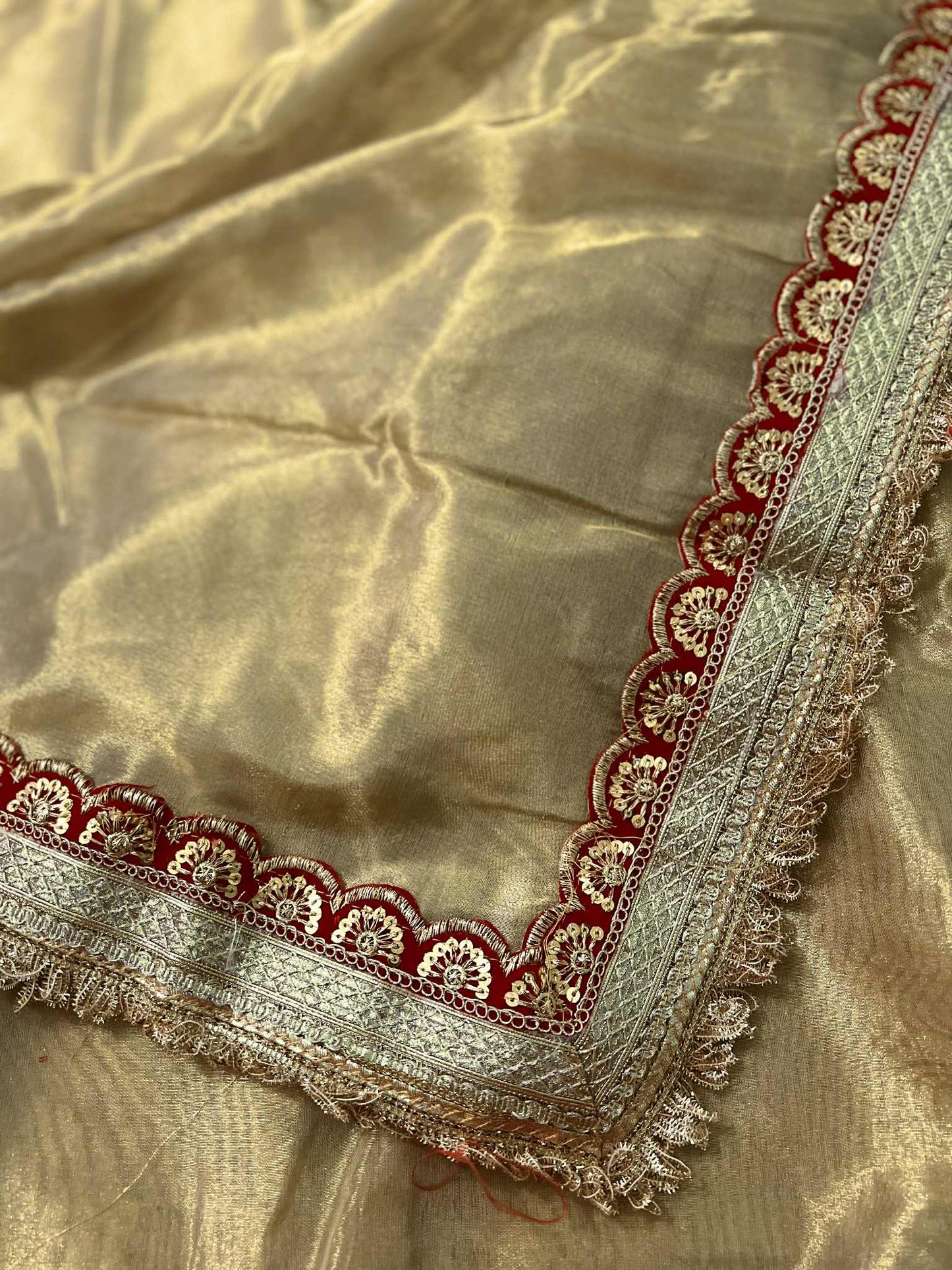 Golden Tissue Saree with Heavy Lace Border and Pallu paired with Velvet Blouse Piece Heavy Lace