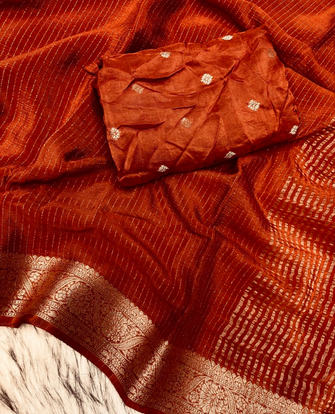 DEEP RUST ORANGE Color Chinon Silk Saree with Jari Lining Allover The Saree with Heavy Weaving Border and Pallu paired with Weaving Chinon Silk Blouse Piece
