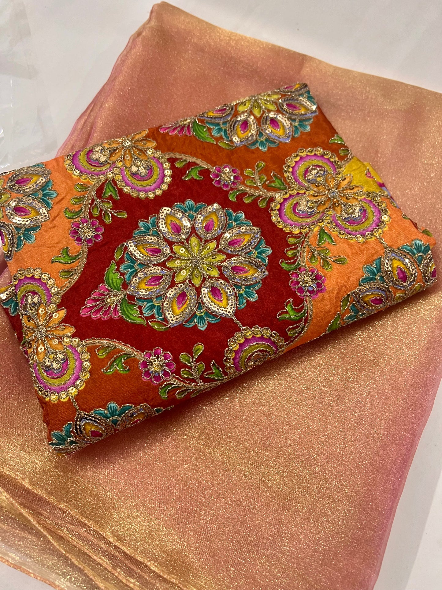 Soft Peach Shimmer Tissue Saree with a luminous golden glow