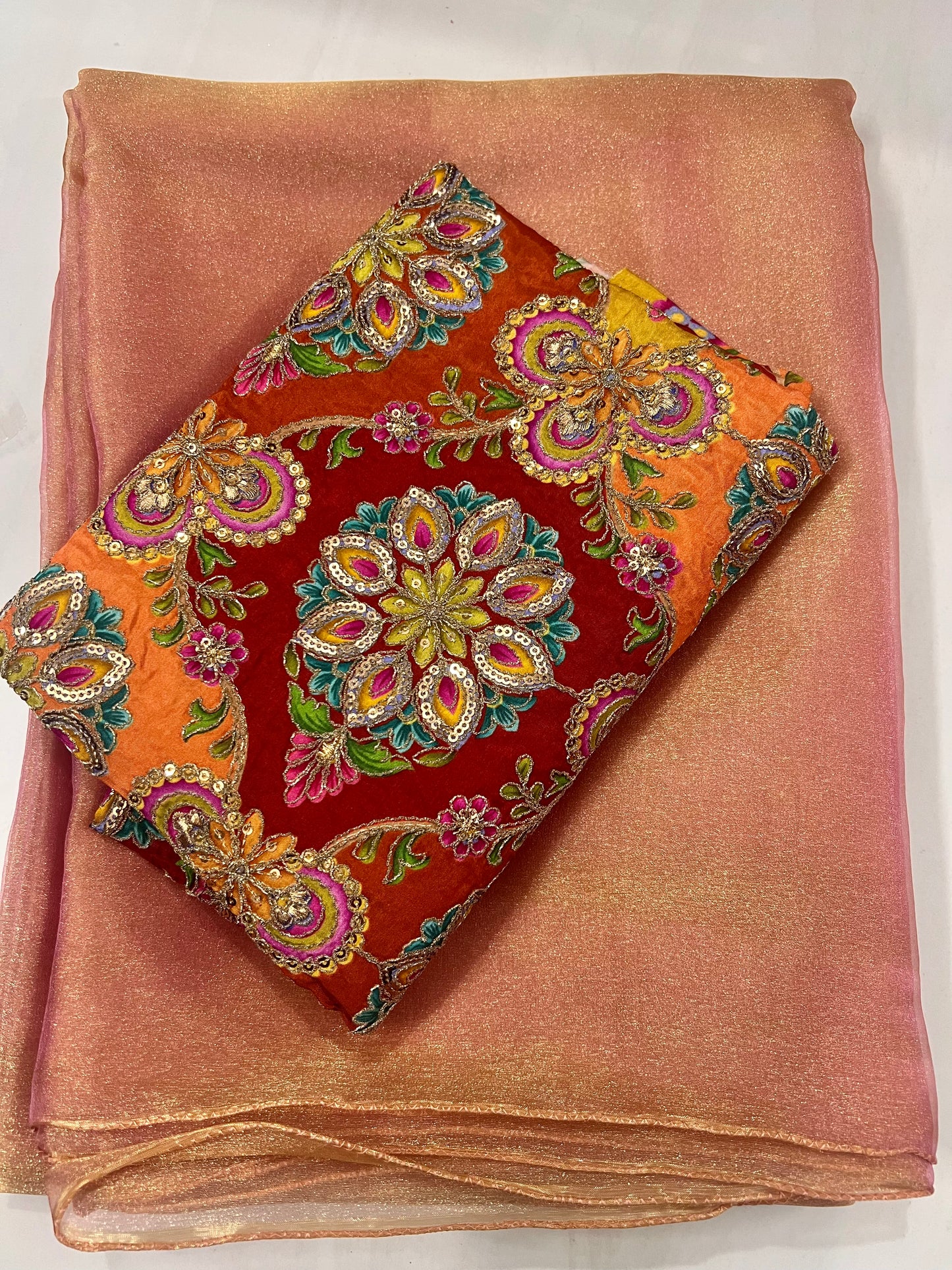 Soft Peach Shimmer Tissue Saree with a luminous golden glow