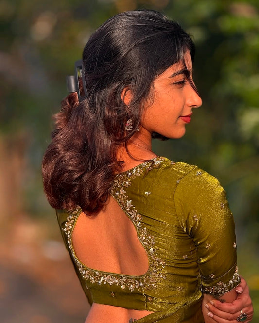 Olive Tone green space silk saree With its fluid shine and graceful drape paired with Hand-embroidered floral detailing Blouse piece with cut-out back for that extra glam