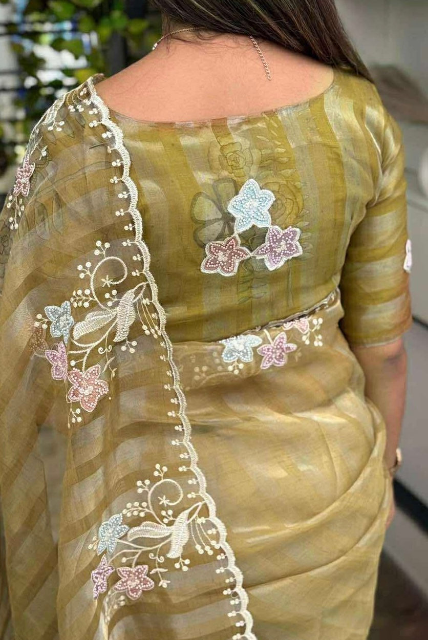 Muted Olive and Pale Gold Shaded Pure Tissue Saree with Thread Embroidery work, Pearl stone work in full saree with Silver and Gold zari weaving stripes