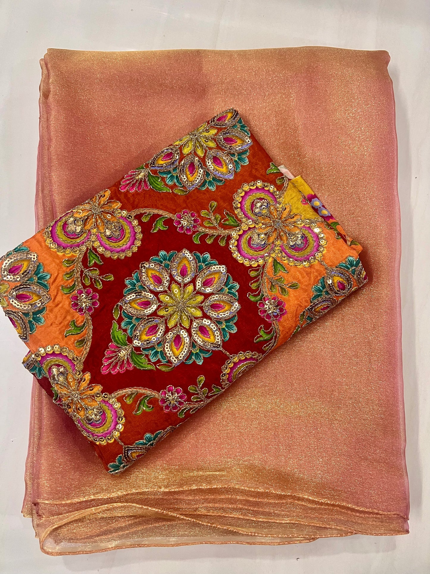 Soft Peach Shimmer Tissue Saree with a luminous golden glow
