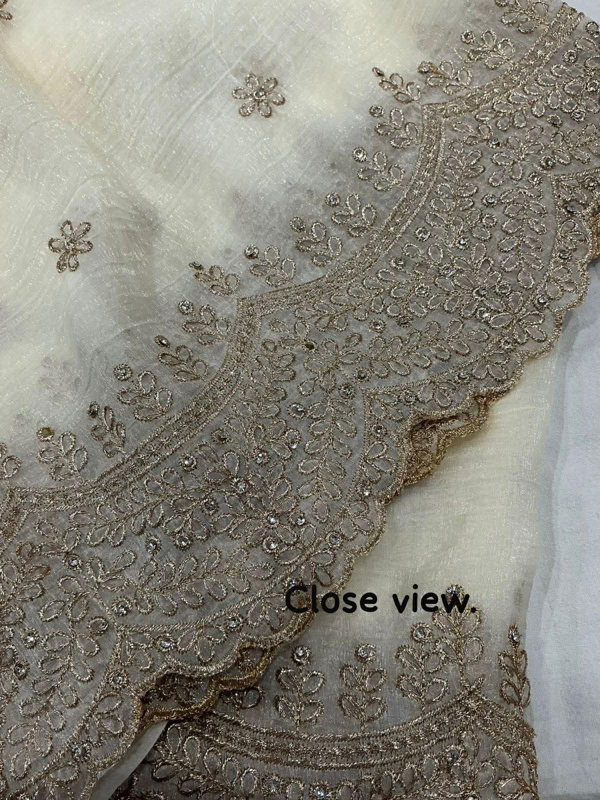 IVORY Color soft crunchy crush georgette saree with zari embroidery and stone work