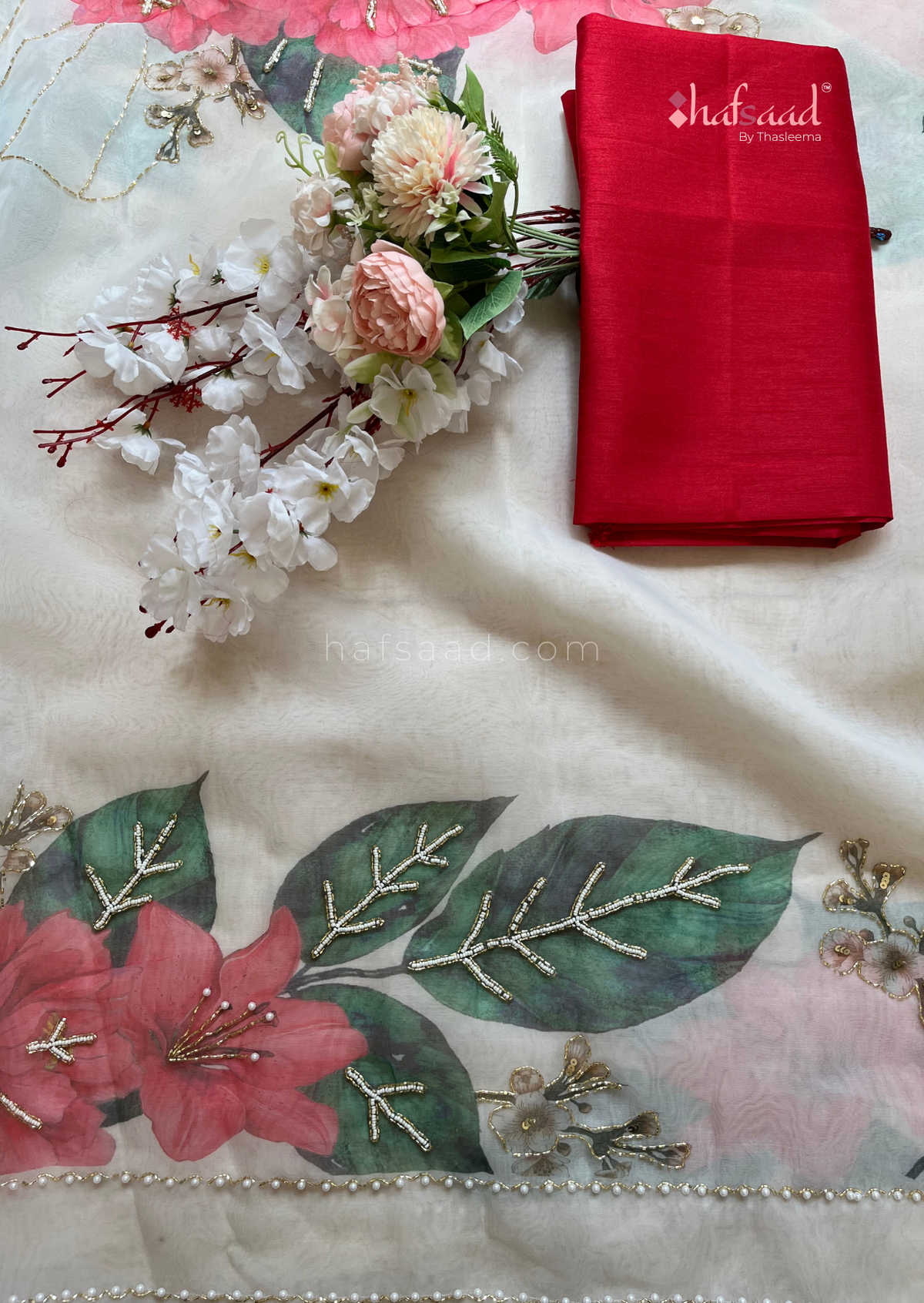 Celestial Printed Elegant Organza Saree with Heavy Handcrafted Khatli and Pearls and Petals work all over saree paired with Plain Cherry Red Color Blouse Piece