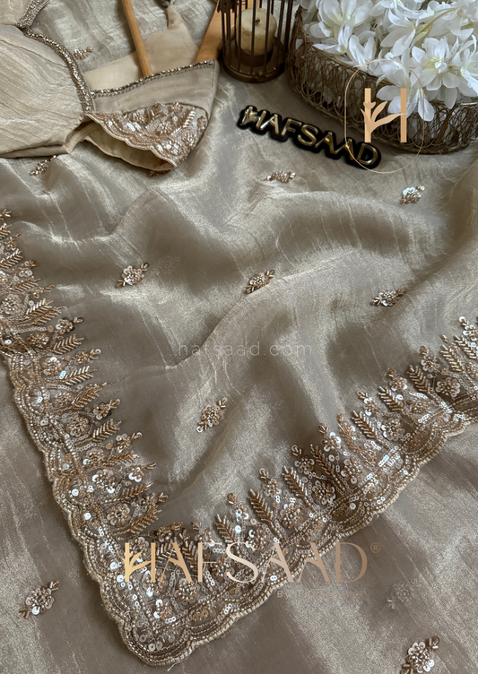 Soft BEIGE Color TISSUE Saree with a royal fall — made for the woman who wears elegance with quiet power...
Filled with Heavy Beads Work, Sequins Work and Khatli Work