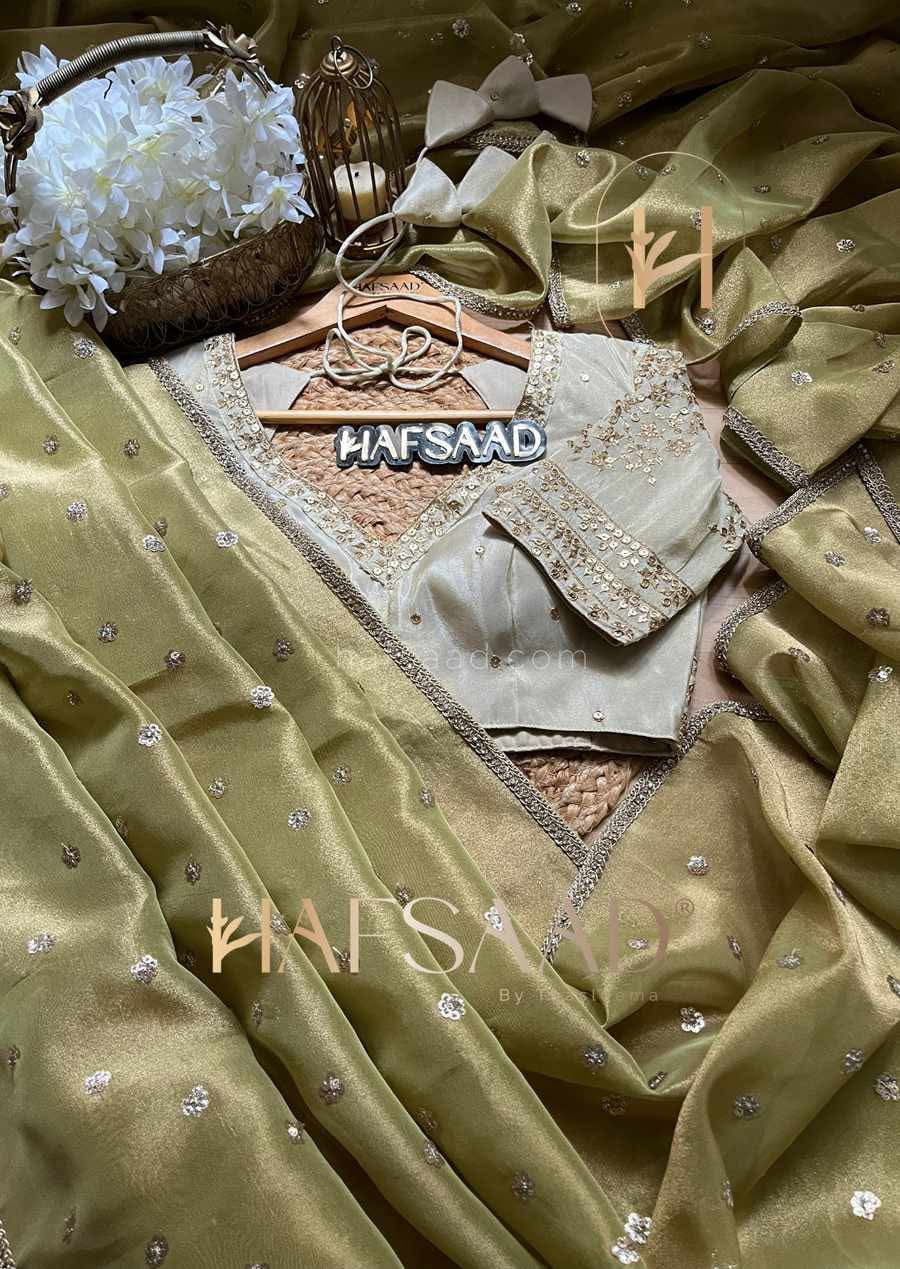 Soft Tissue saree captures the magic of Olive Green and gold hues