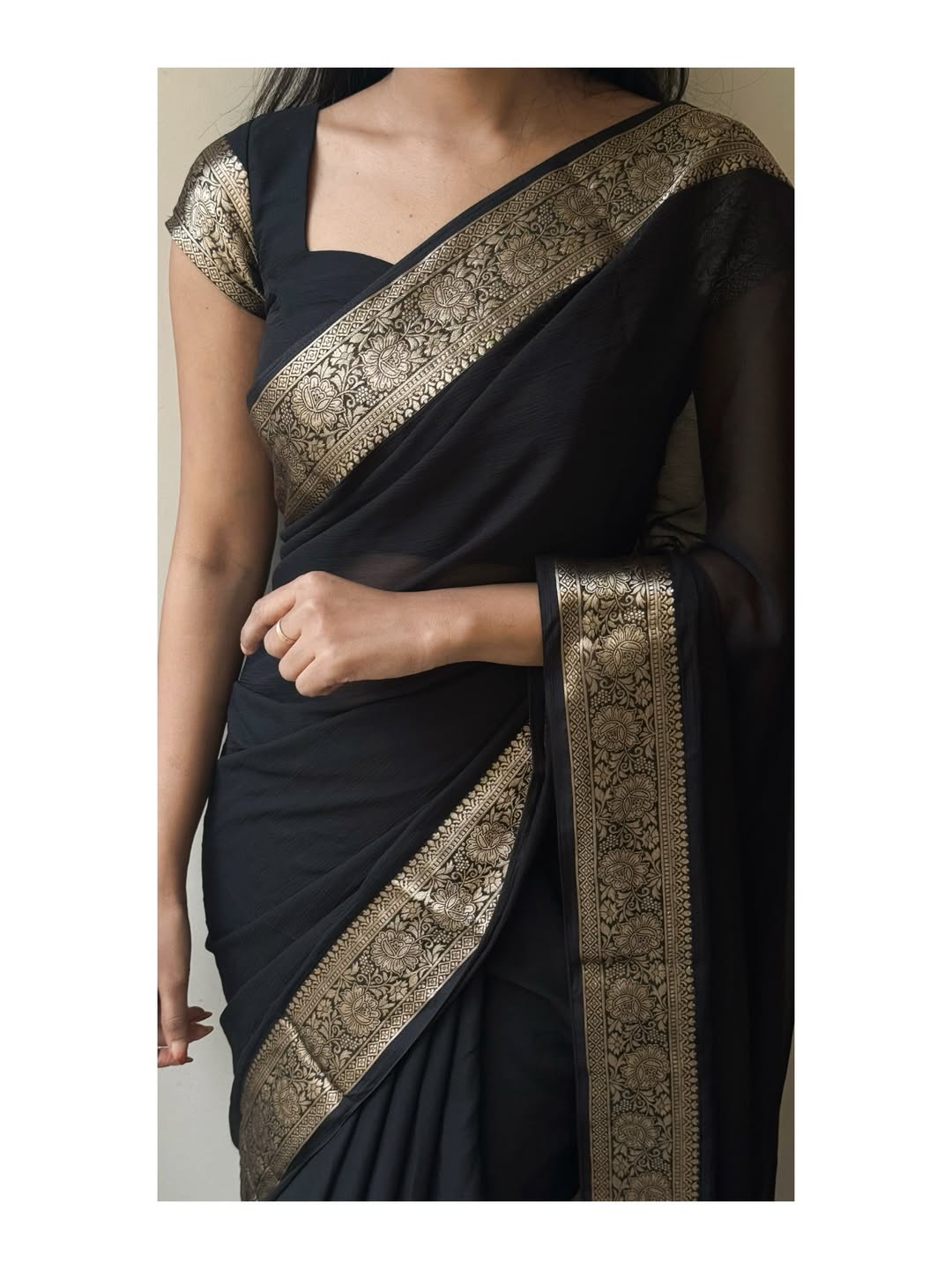 Bold Black Elegance Chiffon Saree— sheer grace with a rich golden border, timeless and powerful