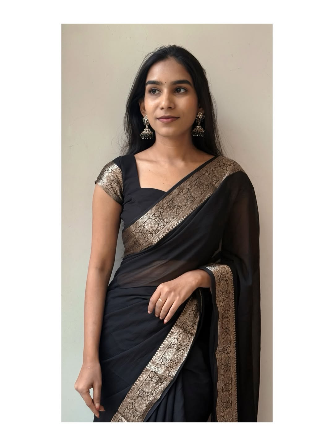 Bold Black Elegance Chiffon Saree— sheer grace with a rich golden border, timeless and powerful